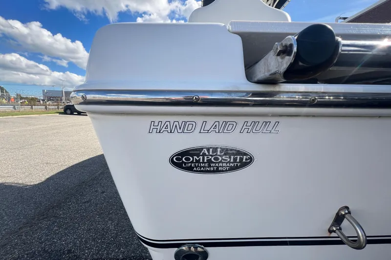 Slide: The Image of 2007 NauticStar 2000 Offshore boat with hand-laid hull and composite warranty badge. - 38