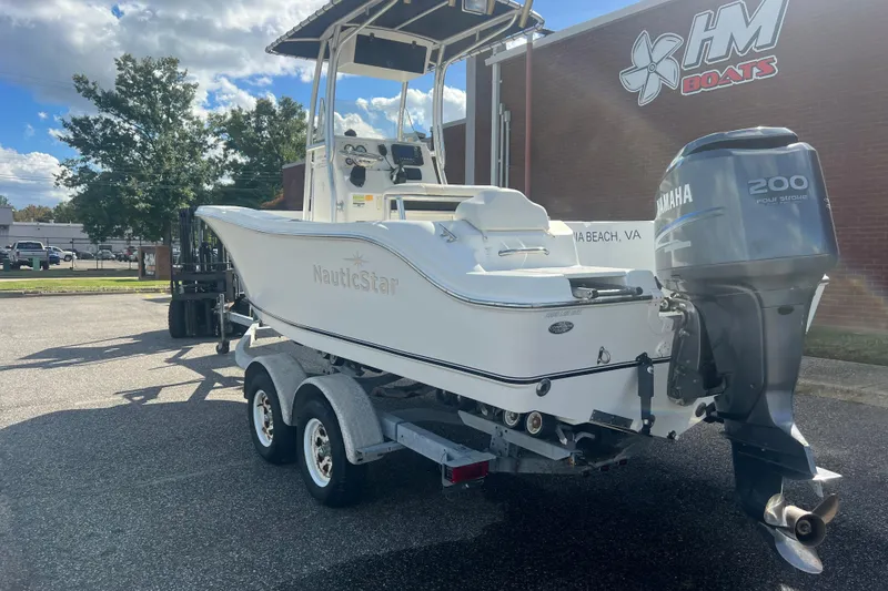Slide: The Image of 2007 NauticStar 2000 Offshore boat with Yamaha 200 engine on trailer, parked outside HM Boats. - 4