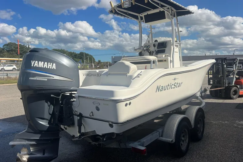 Slide: The Image of 2007 NauticStar 2000 Offshore boat with Yamaha engine on trailer, parked outdoors. - 6