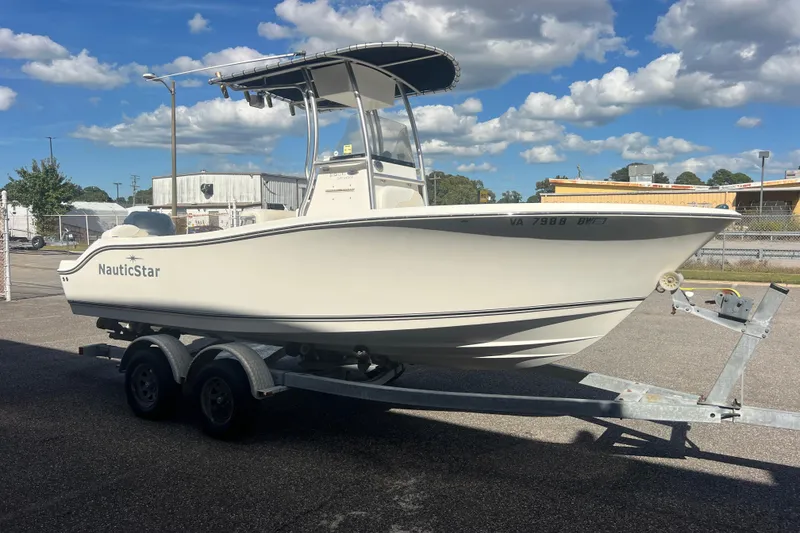 Slide: The Image of 2007 NauticStar 2000 Offshore boat on trailer under blue sky. - 8
