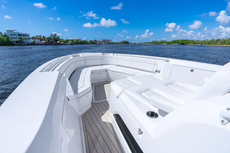 Slide: The Image of Luxurious 2025 Intrepid 41 Panacea boat with spacious seating on a sunny day. - 12