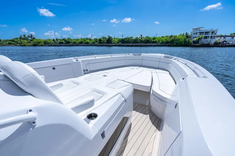 Slide: The Image of 2025 Intrepid 41 Panacea boat with luxurious seating on a sunny day. - 17