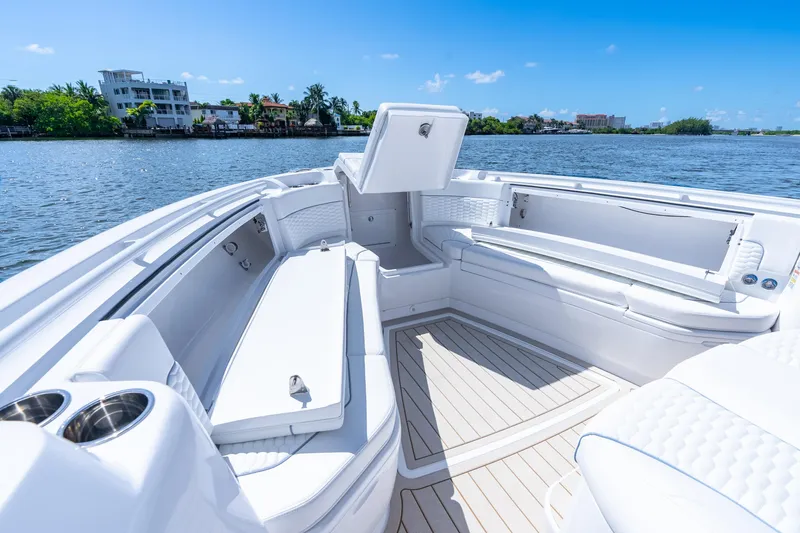 Slide: The Image of Luxurious 2025 Intrepid 41 Panacea boat interior with spacious seating and scenic waterfront view. - 19