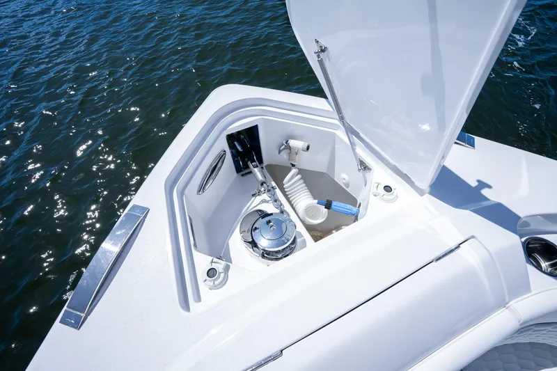 Slide: The Image of Open anchor compartment on 2025 Intrepid 41 Panacea boat, showing marine equipment. - 21