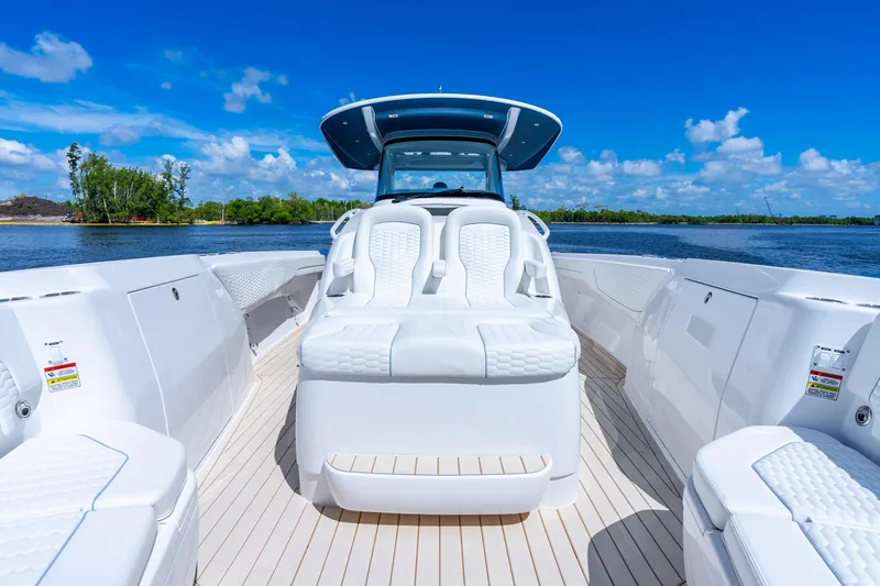 Slide: The Image of 2025 Intrepid 41 Panacea boat with luxurious seating on a sunny day. - 22