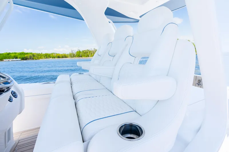 Slide: The Image of Luxurious seating on 2025 Intrepid 41 Panacea yacht, featuring white leather and ocean view. - 31
