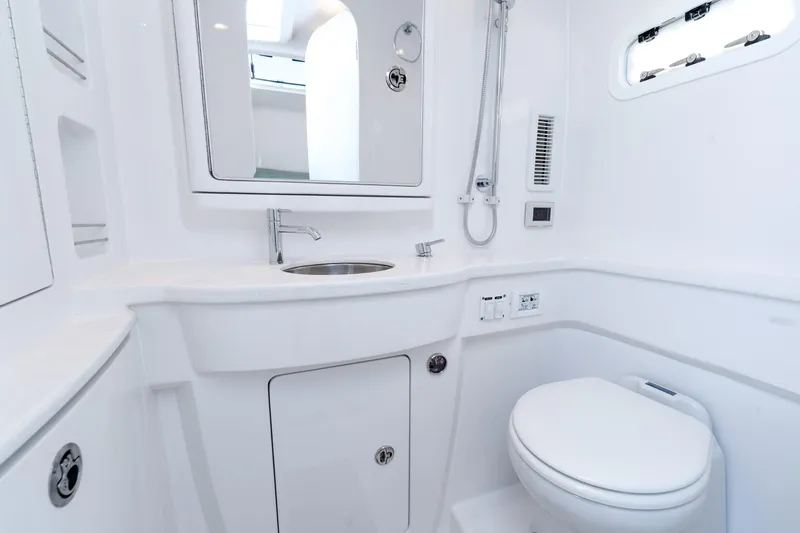 Slide: The Image of Luxurious bathroom interior of 2025 Intrepid 41 Panacea yacht, featuring modern fixtures and sleek design. - 36