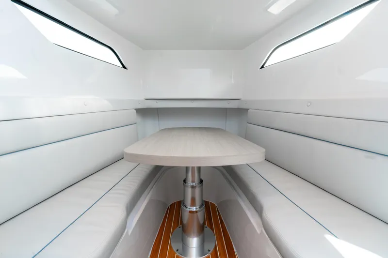 Slide: The Image of Interior of 2025 Intrepid 41 Panacea boat with sleek seating and table. - 40