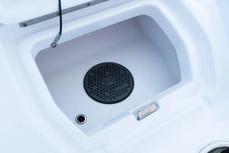 Slide: The Image of Storage compartment in 2025 Intrepid 41 Panacea boat, featuring a black circular vent. - 50