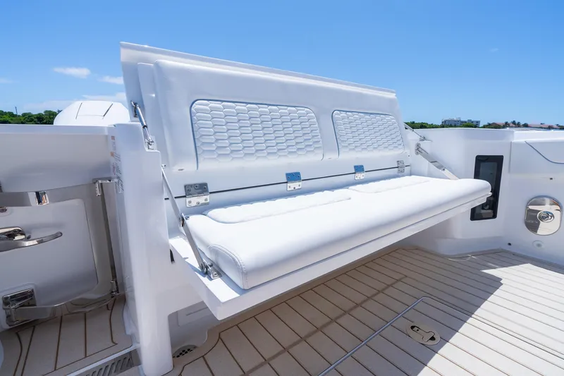 Slide: The Image of 2025 Intrepid 41 Panacea boat with foldable white seating on deck. - 55