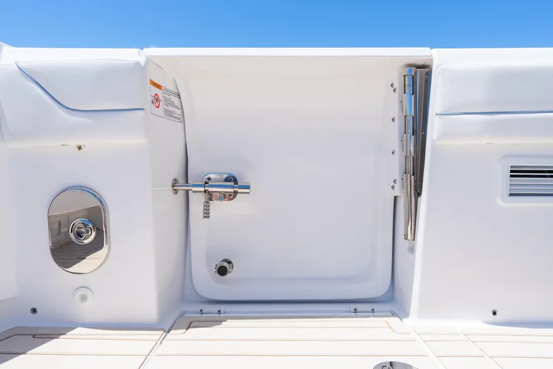 Slide: The Image of 2025 Intrepid 41 Panacea boat hatch detail against clear blue sky. - 60