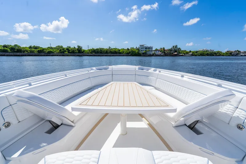 Slide: The Image of Luxurious seating area on 2025 Intrepid 41 Panacea yacht, with scenic waterfront view. - 64