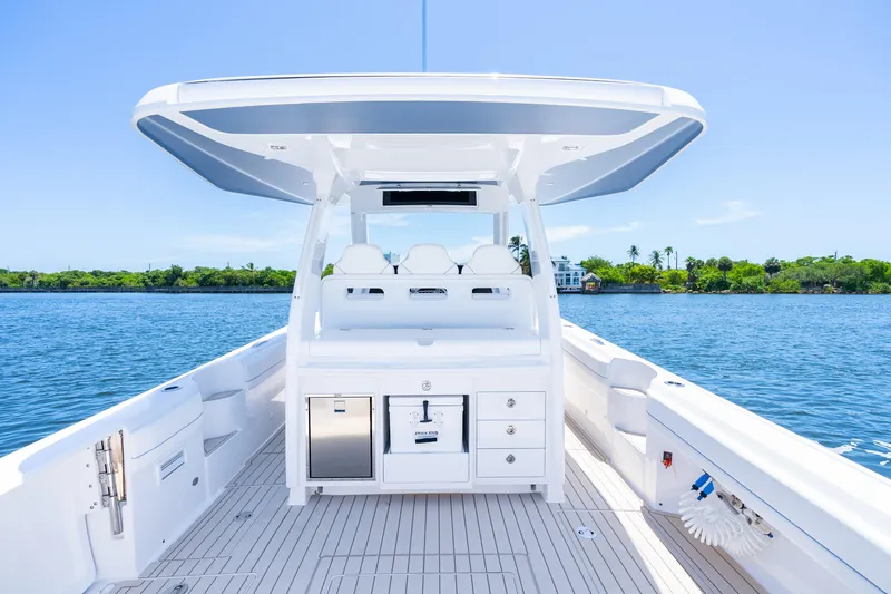 Slide: The Image of 2025 Intrepid 41 Panacea boat interior with sleek design on calm water. - 67