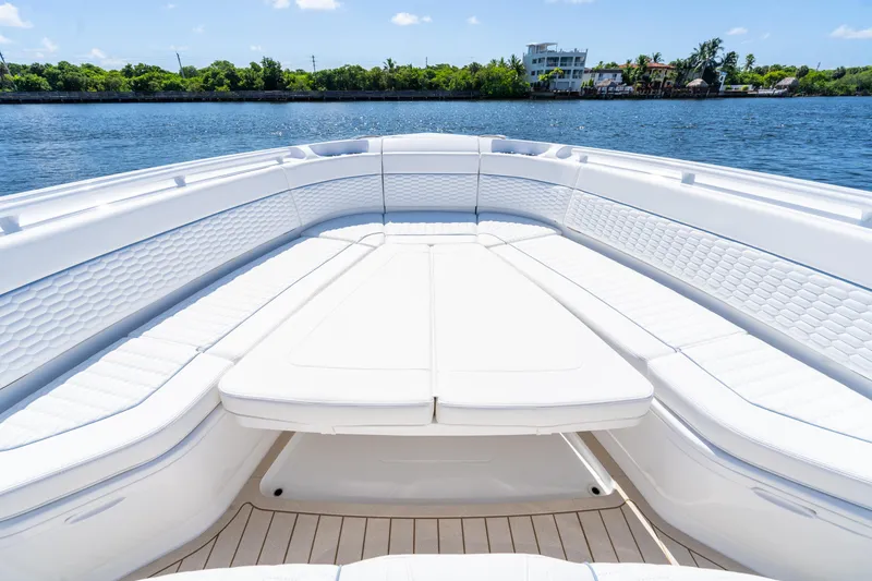 Slide: The Image of Luxurious seating area on 2025 Intrepid 41 Panacea boat, with scenic water view. - 70