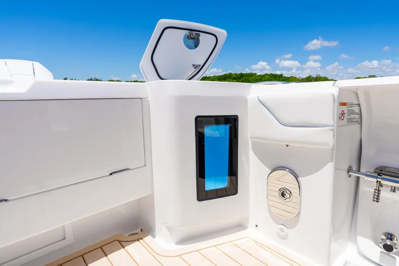 Slide: The Image of 2025 Intrepid 41 Panacea boat interior with sleek white design and modern features. - 75