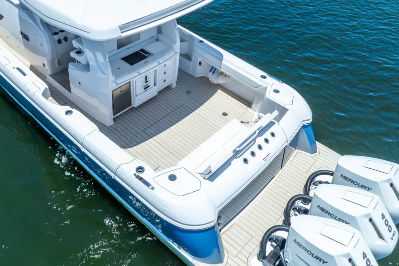 Slide: The Image of 2025 Intrepid 41 Panacea boat with spacious deck and powerful Mercury engines. - 9