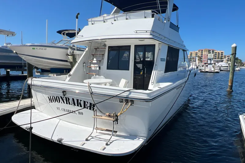 Slide: The Image of 1987 Carver 4227 Cockpit Motor Yacht "Moonraker" docked at marina, sunny day. - 10