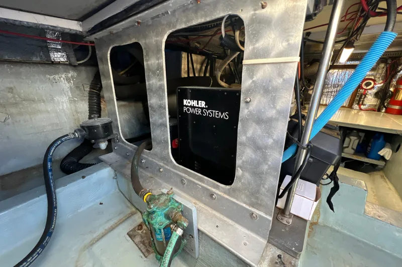 Slide: The Image of Engine room of 1987 Carver 4227 Cockpit Motor Yacht with Kohler power system. - 101