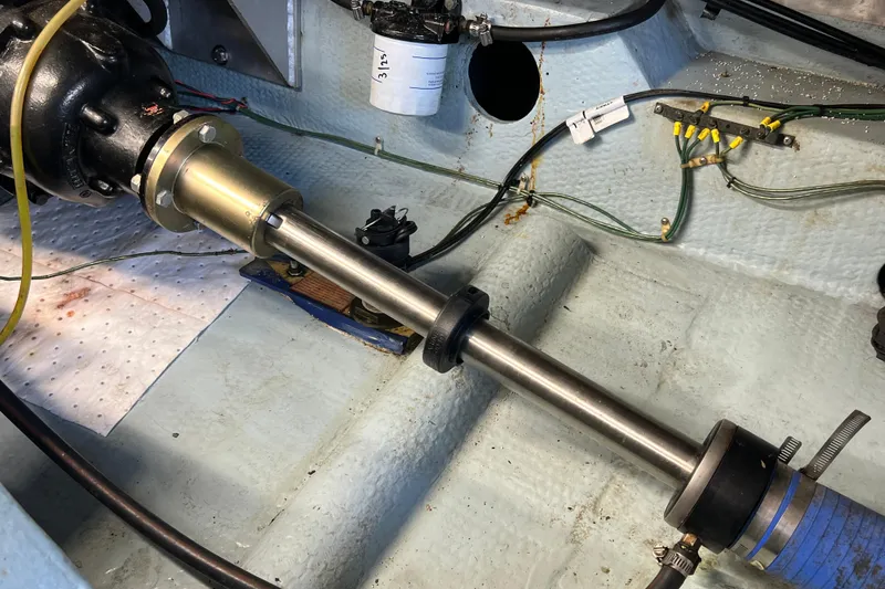 Slide: The Image of Engine compartment of 1987 Carver 4227 Cockpit Motor Yacht showing shaft and wiring. - 106