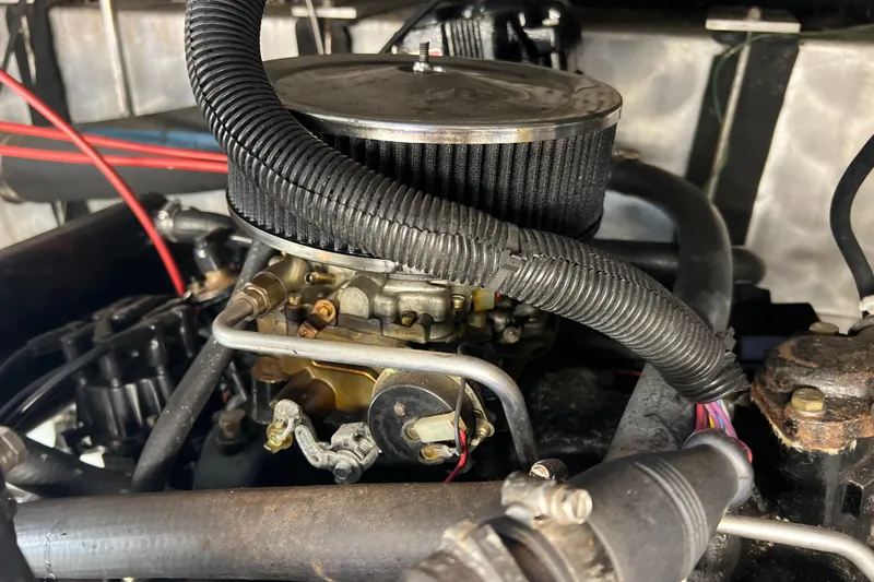 Slide: The Image of Engine compartment of a 1987 Carver 4227 Cockpit Motor Yacht, showcasing detailed components. - 111