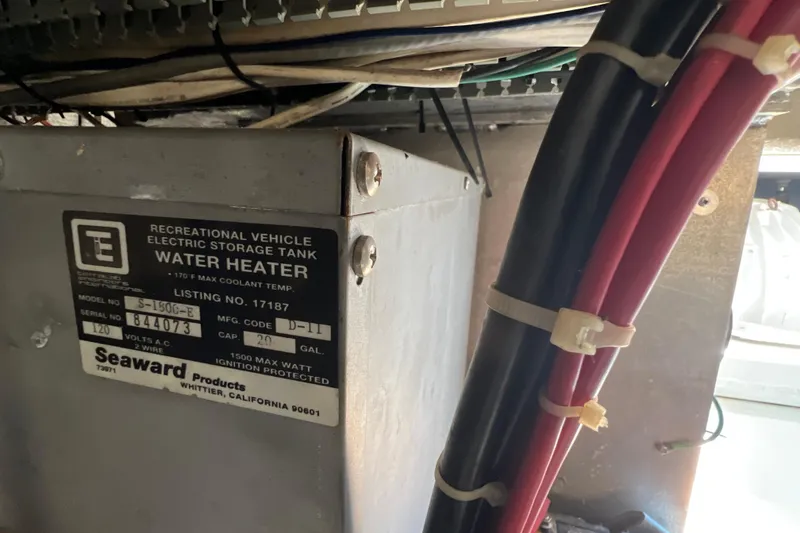 Slide: The Image of Electric water heater in 1987 Carver 4227 Cockpit Motor Yacht engine room. - 115