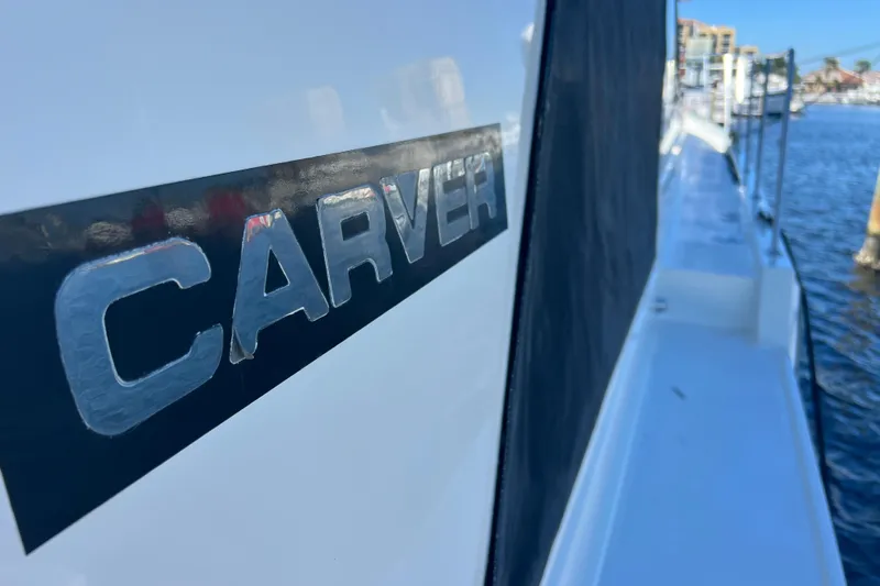 Slide: The Image of Close-up of 1987 Carver 4227 Cockpit Motor Yacht logo on the side. - 32