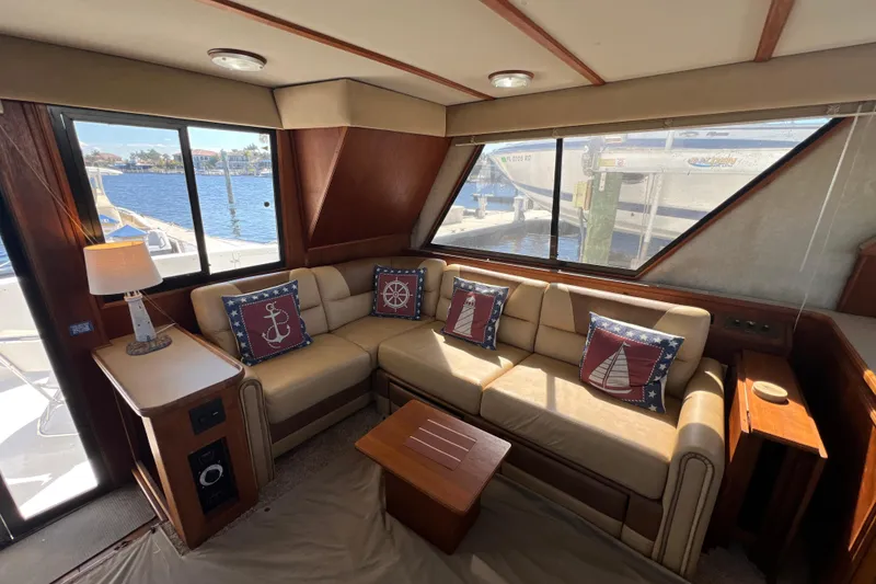 Slide: The Image of Interior of 1987 Carver 4227 Cockpit Motor Yacht with nautical-themed decor. - 36