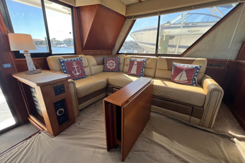 Slide: The Image of Interior of 1987 Carver 4227 Cockpit Motor Yacht with cozy seating and nautical decor. - 38