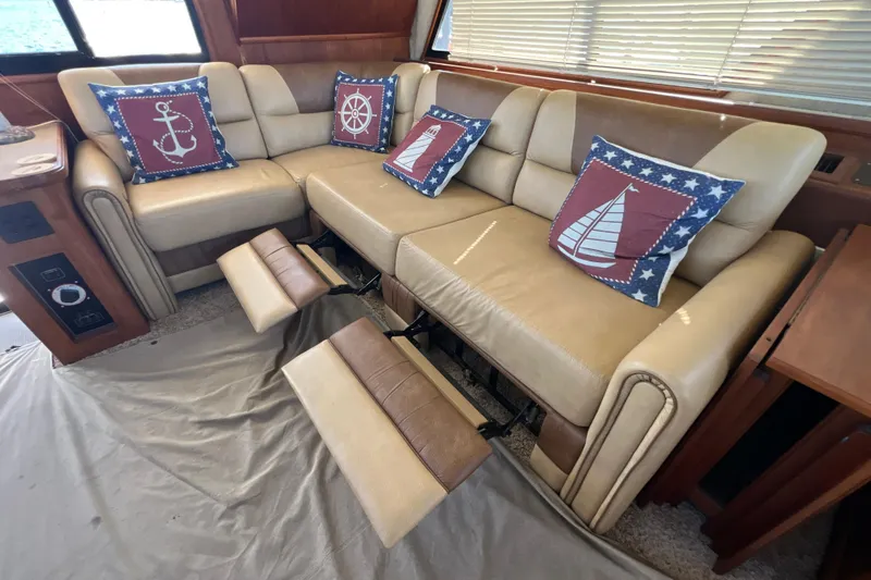 Slide: The Image of Luxurious interior of 1987 Carver 4227 Cockpit Motor Yacht with nautical-themed cushions. - 41