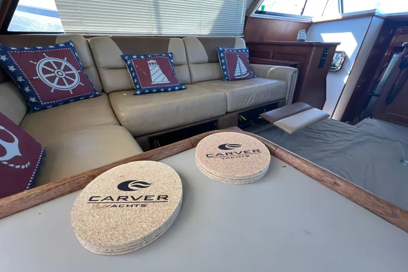 Slide: The Image of Luxurious interior of 1987 Carver 4227 Cockpit Motor Yacht with nautical-themed decor. - 42