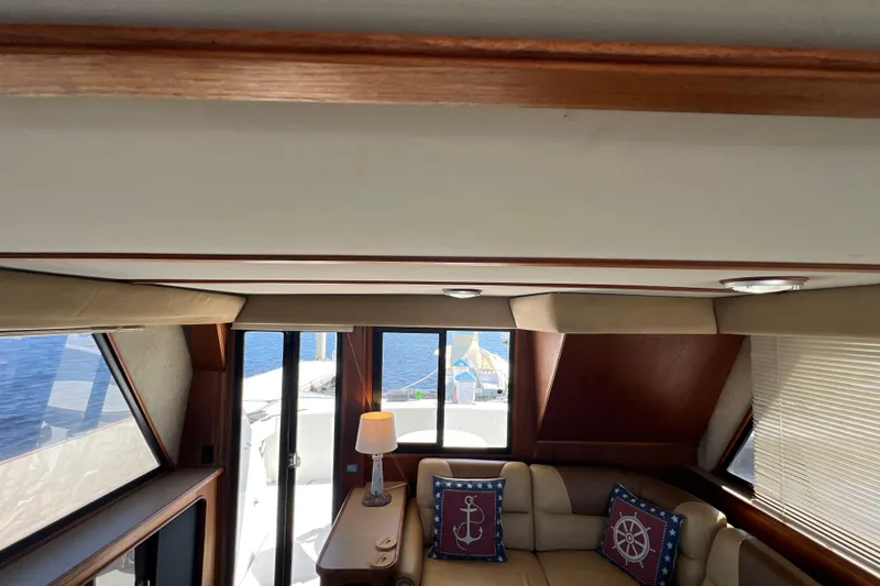 Slide: The Image of Interior of 1987 Carver 4227 Cockpit Motor Yacht with nautical-themed decor. - 45