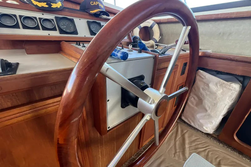Slide: The Image of Steering wheel of 1987 Carver 4227 Cockpit Motor Yacht with nautical decor. - 50