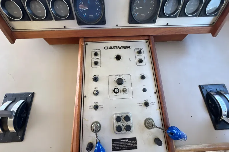 Slide: The Image of Control panel of a 1987 Carver 4227 Cockpit Motor Yacht with gauges and switches. - 51