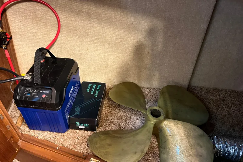 Slide: The Image of Battery, charger, and propeller inside 1987 Carver 4227 Cockpit Motor Yacht. - 70