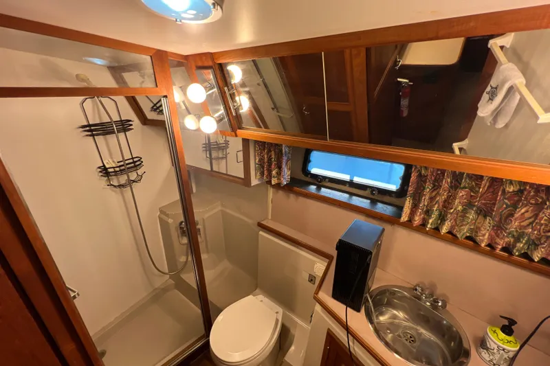 Slide: The Image of Bathroom interior of 1987 Carver 4227 Cockpit Motor Yacht with shower and sink. - 72