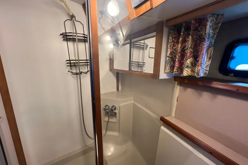 Slide: The Image of Bathroom interior of 1987 Carver 4227 Cockpit Motor Yacht with shower and window. - 75
