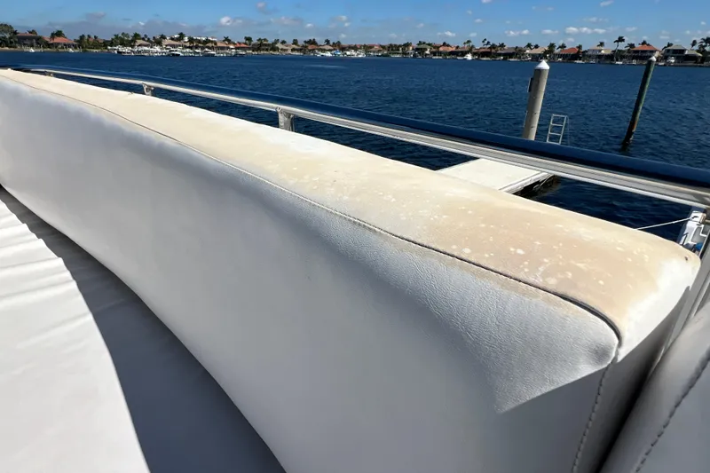 Slide: The Image of 1987 Carver 4227 Cockpit Motor Yacht with sunlit seating and ocean view. - 85