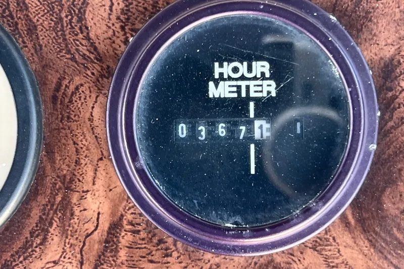Slide: The Image of Hour meter reading 3671 on 1987 Carver 4227 Cockpit Motor Yacht. - 88