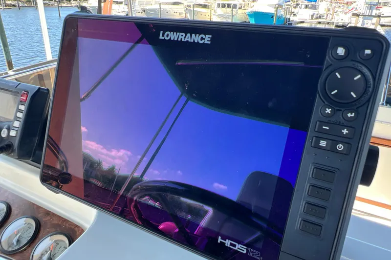 Slide: The Image of Lowrance navigation system on 1987 Carver 4227 Cockpit Motor Yacht dashboard. - 91