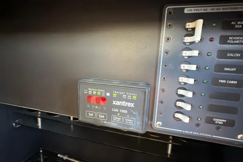 Slide: The Image of Control panel of a 1987 Carver 4227 Cockpit Motor Yacht with Xantrex Link 1000 system. - 95