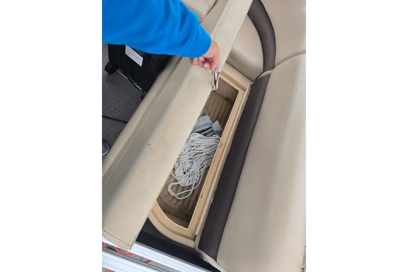 Slide: The Image of 2019 TRACKER MARINE Bass Buggy storage compartment with rope inside. - 12