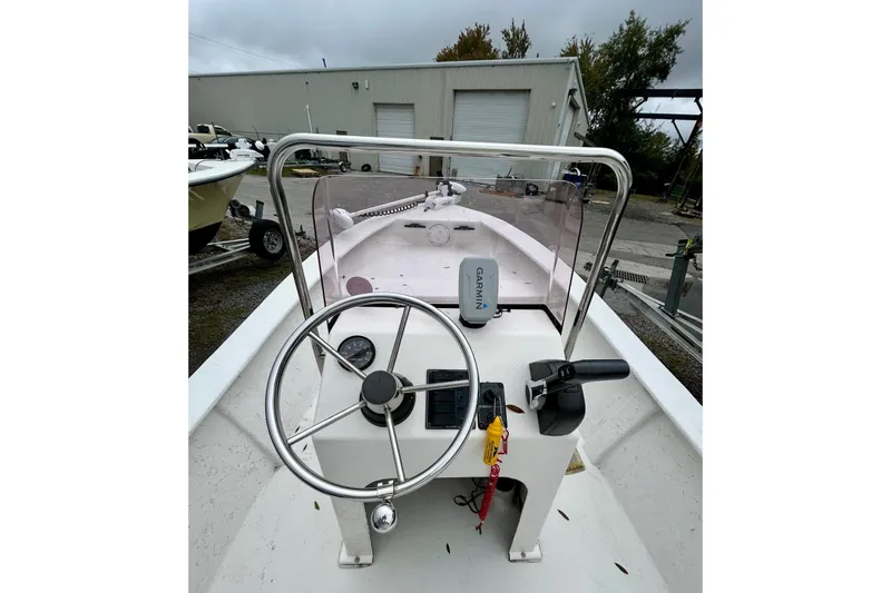 Slide: The Image of 2021 May-Craft 1700CC boat console with steering wheel and Garmin device. - 5