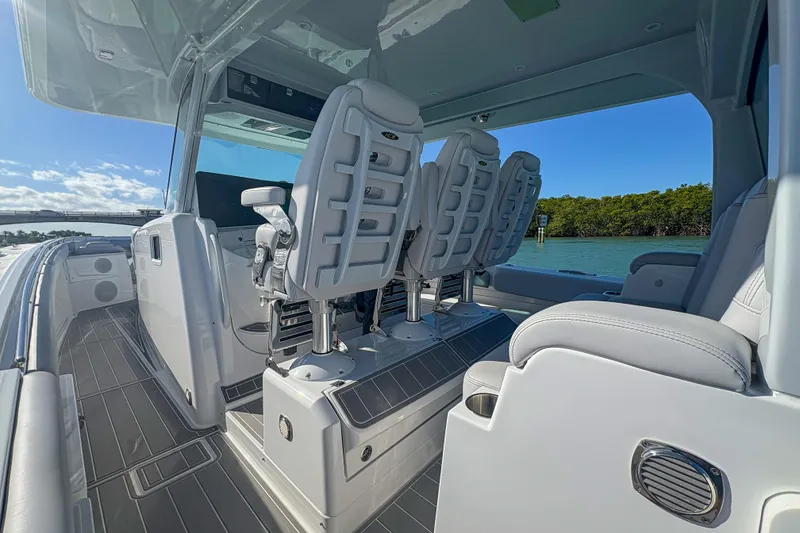 Slide: The Image of 2024 HCB 53 Sueños boat interior with sleek seating and modern design on open water. - 44