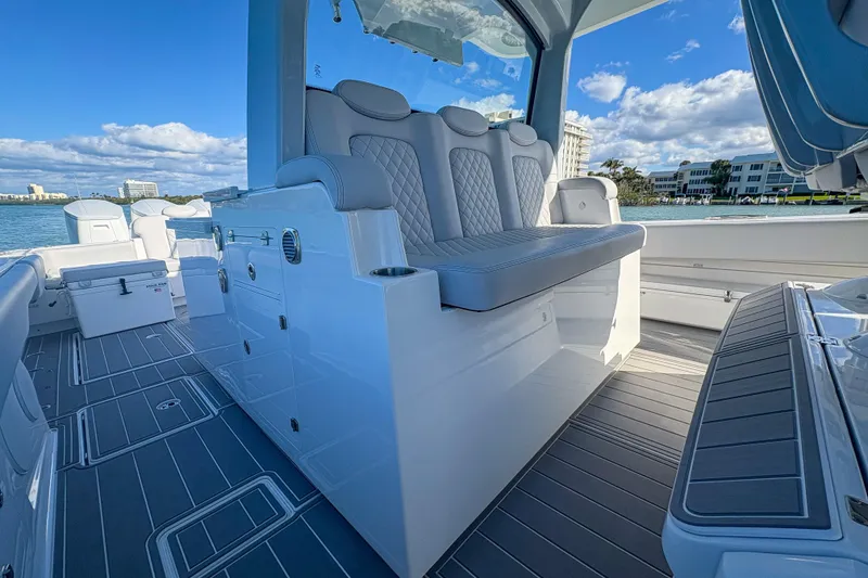Slide: The Image of 2024 HCB 53 Sueños boat interior with luxurious seating and sleek design. - 46