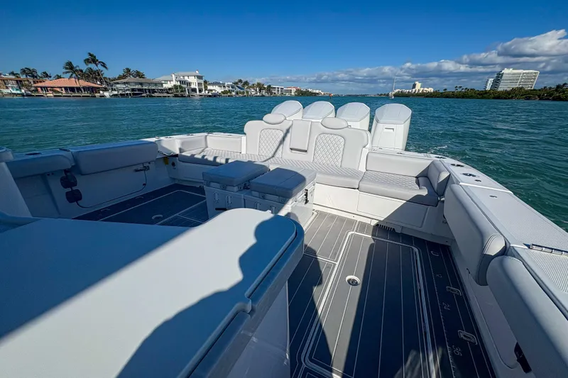 Slide: The Image of Luxurious 2024 HCB 53 Sueños boat interior with spacious seating on a sunny day. - 56