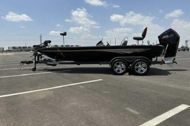 The Image of 2025 Ranger ALPHA 208 boat in parking lot under clear sky. - 0