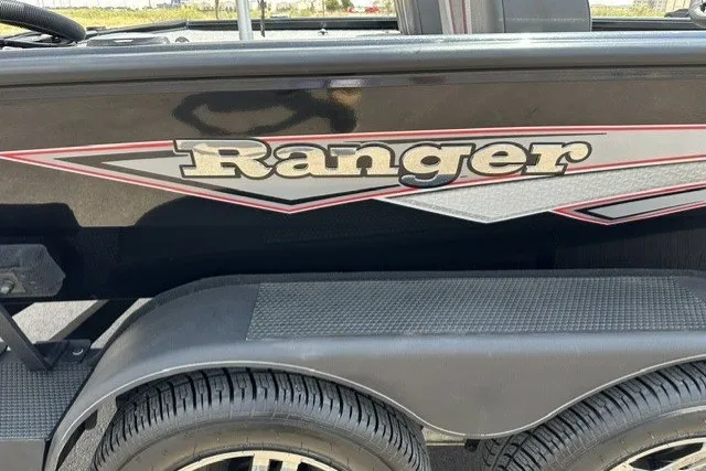 Slide: The Image of 2025 Ranger ALPHA 208 boat with sleek design and logo detail. - 23