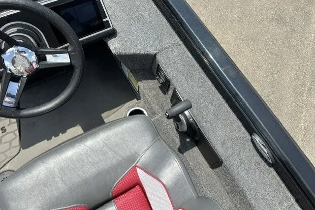 Slide: The Image of Interior of 2025 Ranger ALPHA 208 boat with steering wheel and seat detail. - 22