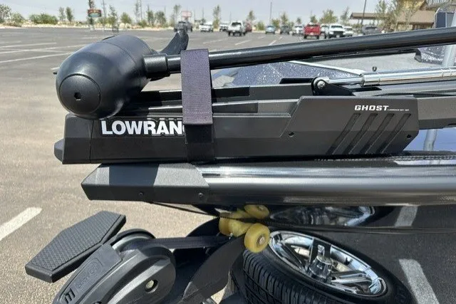 Slide: The Image of Ranger ALPHA 208 (2025) with Lowrance Ghost trolling motor in a parking lot. - 12