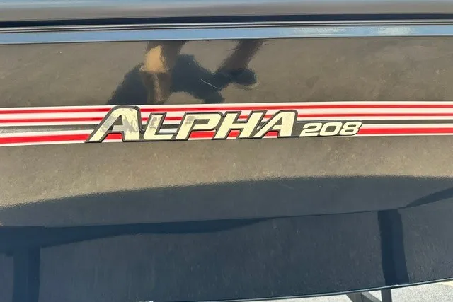 Slide: The Image of 2025 Ranger ALPHA 208 logo with red and white stripes on a dark surface. - 2